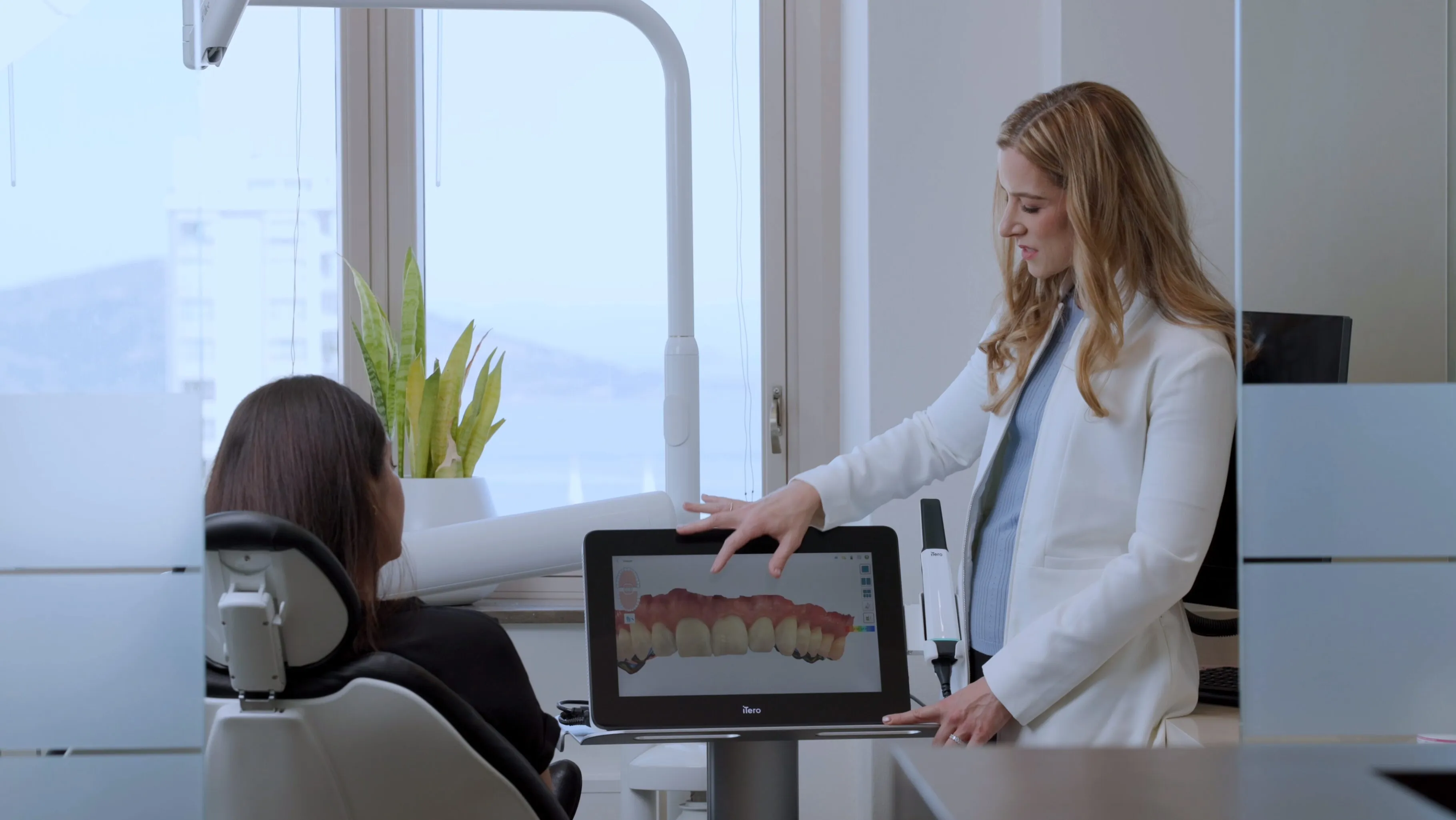 Dr. Hain walking a patient through their Invisalign scan at Smile! San Francisco