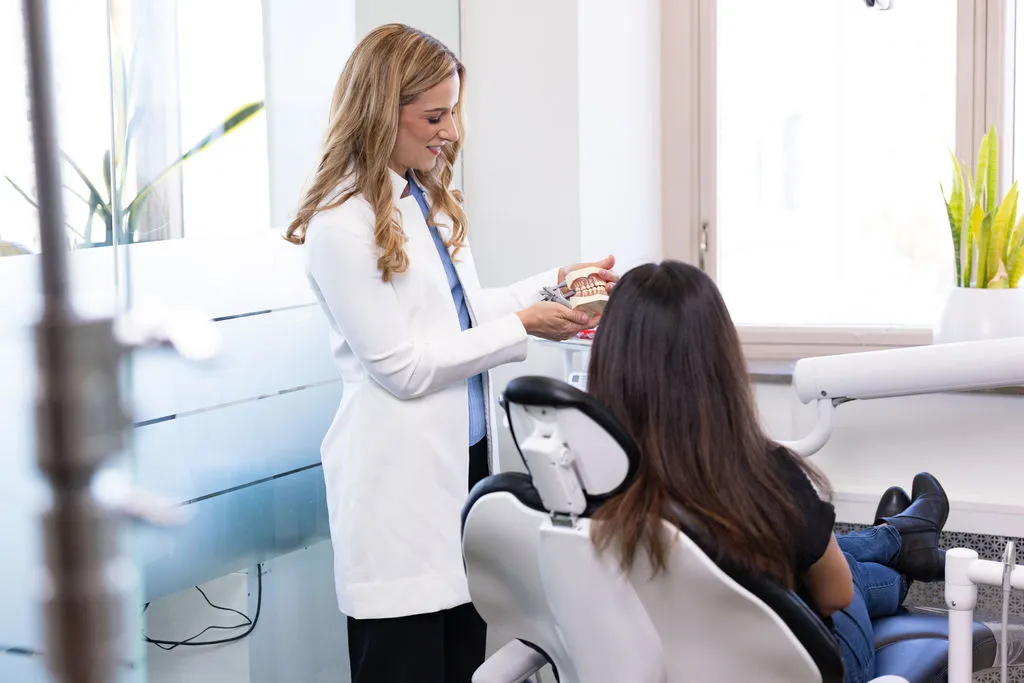 Dr. Hain explaining a treatment plan to a patient