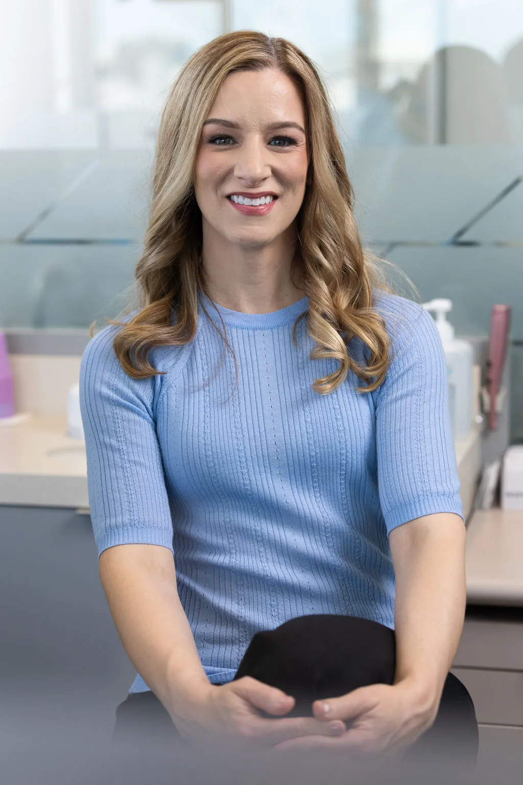 Dr. Courtney Hain seated in the office