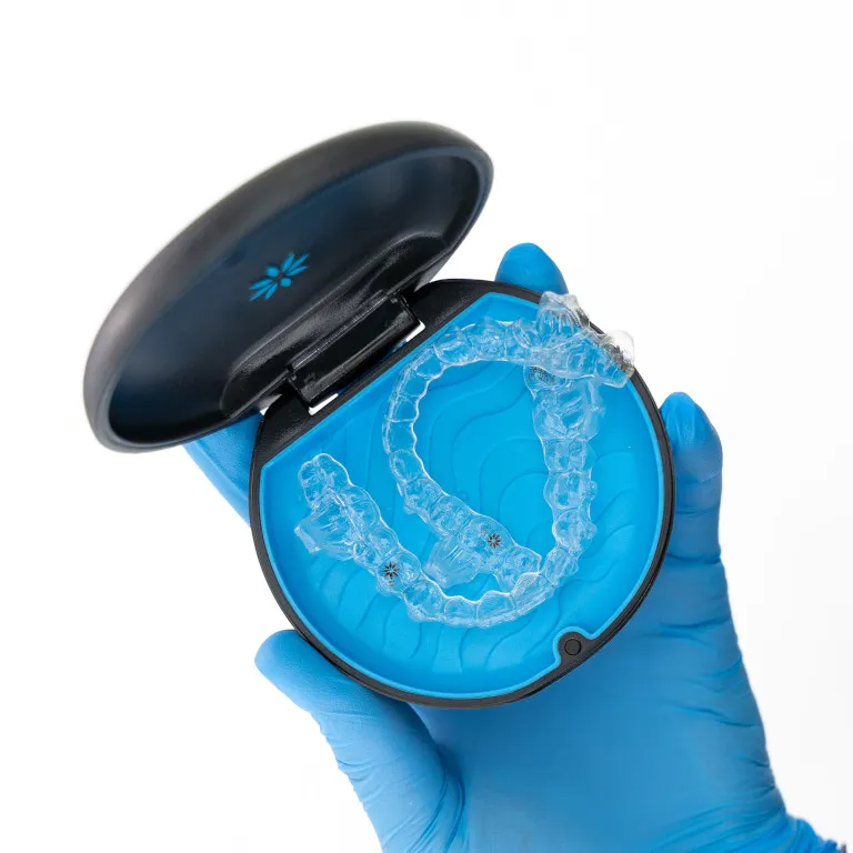 Clear Invisalign aligner trays held in their case
